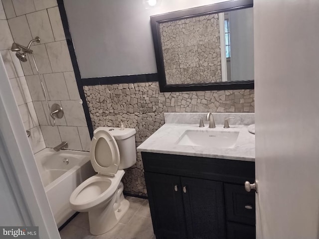 2841 Aquarius Ave, Silver Spring, MD 20906 - full bathroom with vanity, toilet, shower / bath combination, tile patterned flooring, and tile walls