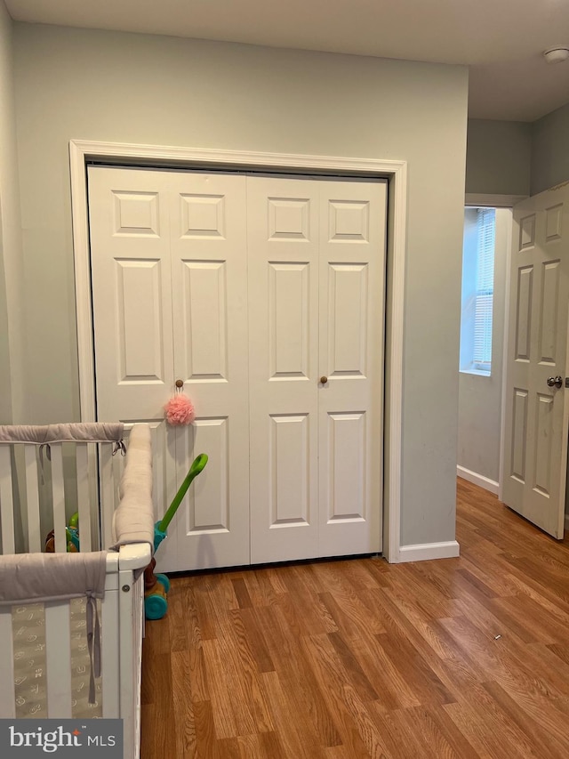 3431 N 19th St, Philadelphia, PA 19140 - unfurnished bedroom with a closet, wood finished floors, and baseboards