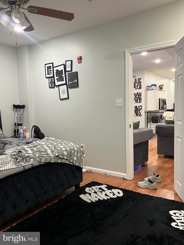 3431 N 19th St, Philadelphia, PA 19140 - bedroom with light wood-type flooring, a ceiling fan, and baseboards