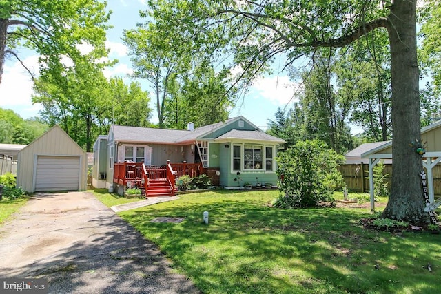 3552 Oak Dr, Edgewater, MD 21037 - view of front of home featuring a deck, an outbuilding, and asphalt driveway