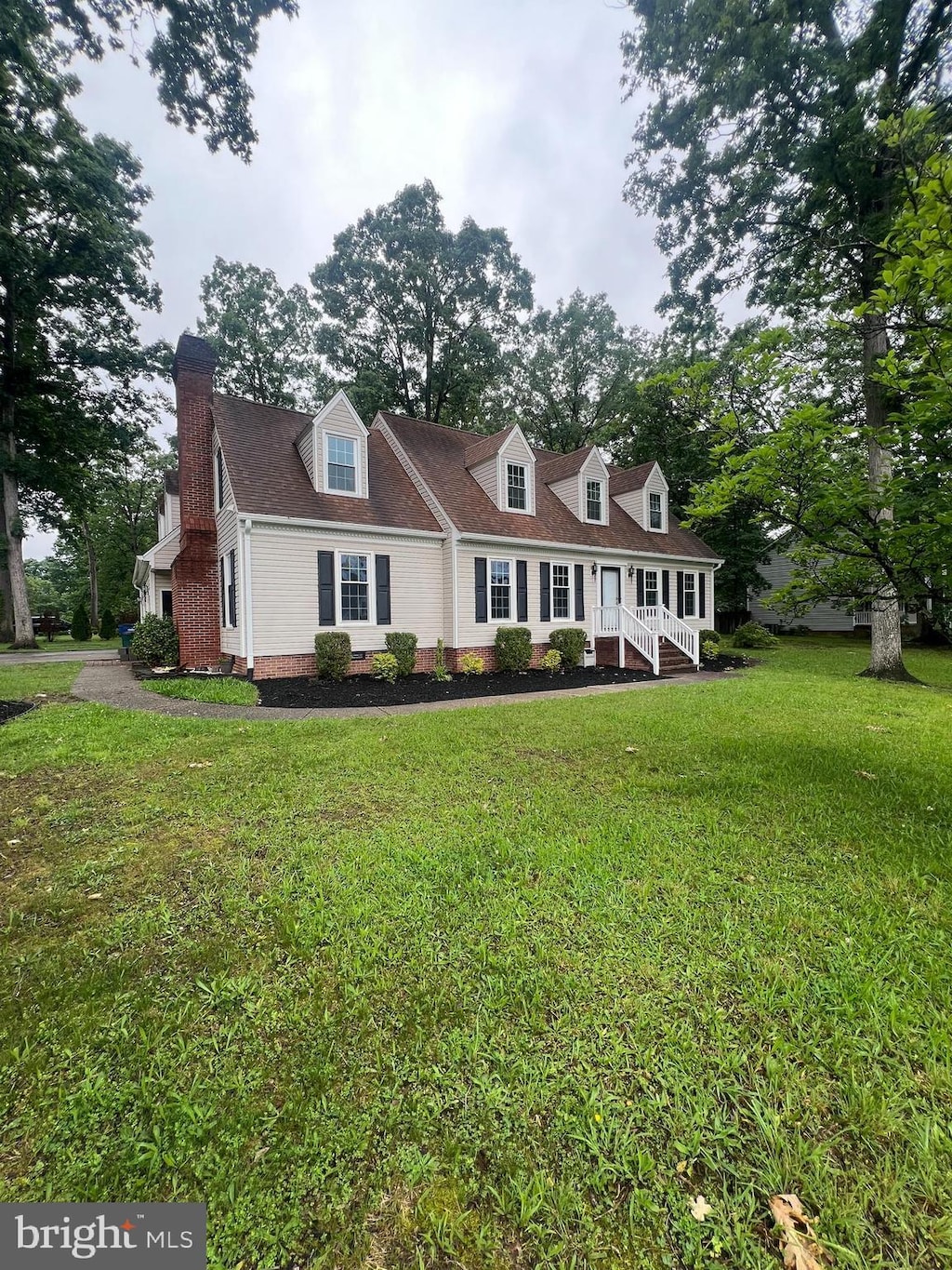 22 Braddock Dr, Fredericksburg, VA 22405 - cape cod home featuring a front yard, a chimney, and crawl space