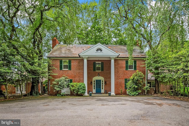 2705 Houcks Mill Rd, Monkton, MD 21111 - neoclassical home with a chimney and brick siding