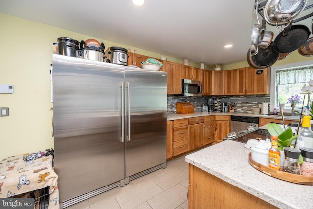 1341 Westview Xing, Grantsville, MD 21536 - kitchen featuring appliances with stainless steel finishes, backsplash, recessed lighting, brown cabinets, and light tile patterned flooring