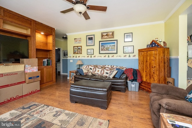 1341 Westview Xing, Grantsville, MD 21536 - living area featuring crown molding, a wainscoted wall, a ceiling fan, and light wood finished floors