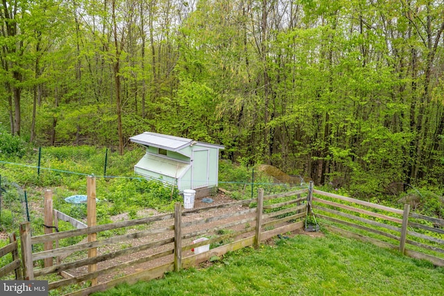 1341 Westview Xing, Grantsville, MD 21536 - view of yard featuring a shed, an outbuilding, and a forest view