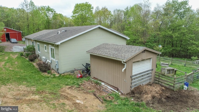 1341 Westview Xing, Grantsville, MD 21536 - view of home's exterior featuring roof with shingles, an outbuilding, and a detached garage
