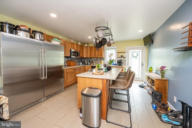 1341 Westview Xing, Grantsville, MD 21536 - kitchen featuring appliances with stainless steel finishes, light countertops, decorative backsplash, recessed lighting, and a kitchen island