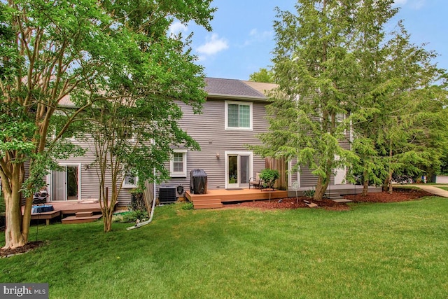 17 Edgewood Green Ct, Annapolis, MD 21403 - rear view of property featuring a deck, central AC, and a lawn