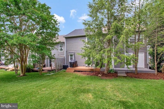 17 Edgewood Green Ct, Annapolis, MD 21403 - back of property with a wooden deck, a lawn, and central AC