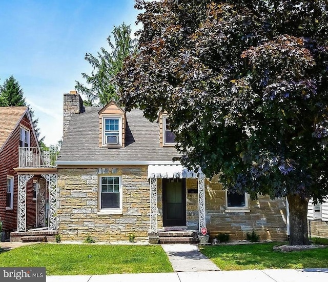 904 W Burke St, Martinsburg, WV 25401 - view of front of home with stone siding, a front lawn, a chimney, and roof with shingles