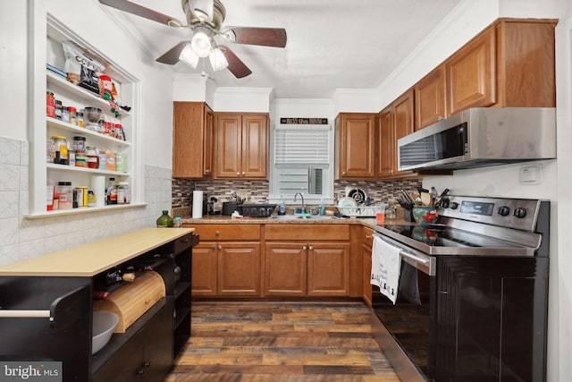 904 W Burke St, Martinsburg, WV 25401 - kitchen featuring appliances with stainless steel finishes, a ceiling fan, brown cabinetry, a sink, and dark wood-type flooring