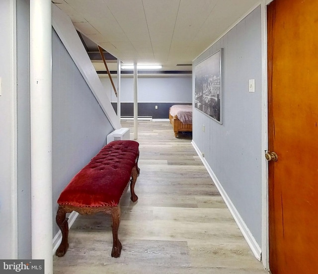 904 W Burke St, Martinsburg, WV 25401 - corridor with wood finished floors and a baseboard heating unit