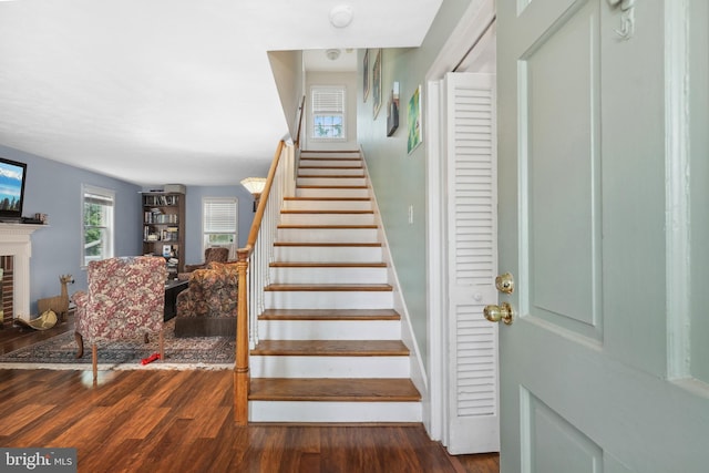 904 W Burke St, Martinsburg, WV 25401 - stairway with wood finished floors and a brick fireplace