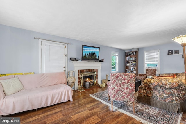 904 W Burke St, Martinsburg, WV 25401 - living area with wood finished floors and a brick fireplace