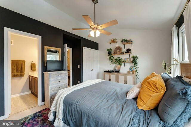 43602 Blacksmith Sq, Ashburn, VA 20147 - bedroom with multiple windows, ensuite bathroom, a ceiling fan, and a closet