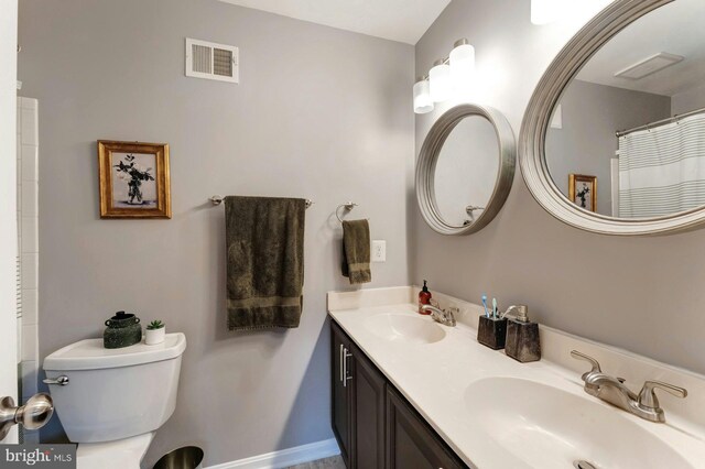 43602 Blacksmith Sq, Ashburn, VA 20147 - full bathroom featuring toilet, double vanity, baseboards, and a shower with curtain