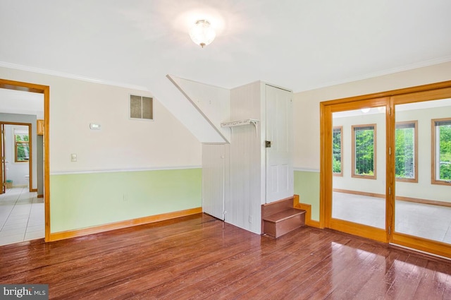 22350 Old Hundred Rd, Barnesville, MD 20838 - unfurnished living room featuring wood finished floors, baseboards, stairs, and crown molding