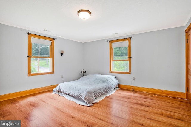 22350 Old Hundred Rd, Barnesville, MD 20838 - bedroom with crown molding, baseboards, and wood finished floors