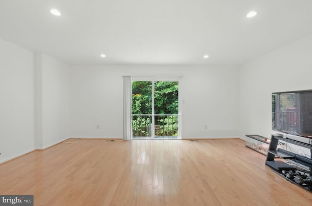 1252 Knoll Mist Ln, Gaithersburg, MD 20879 - unfurnished living room featuring wood finished floors and recessed lighting