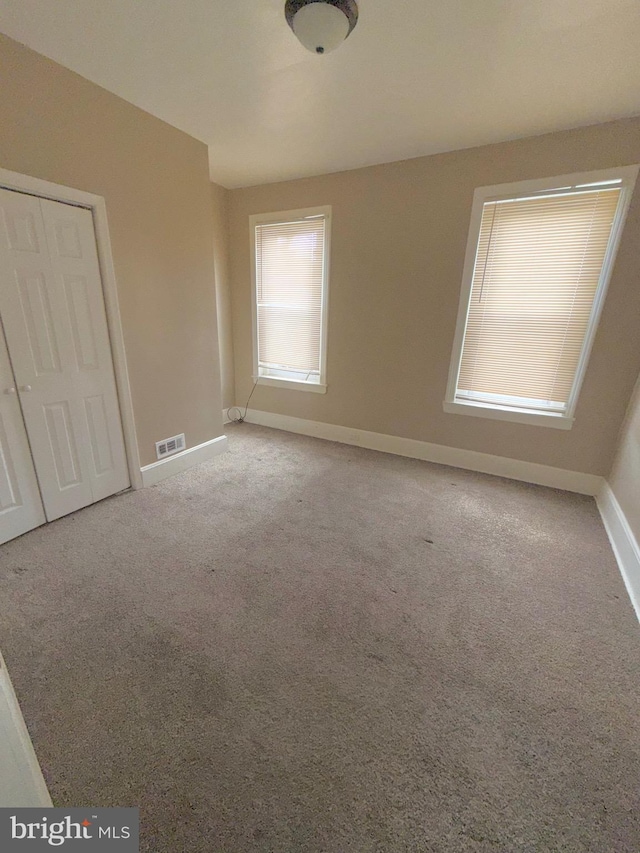 2735 N Sydenham St, Philadelphia, PA 19132 - unfurnished bedroom featuring baseboards and carpet floors