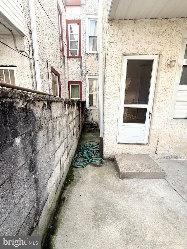 2735 N Sydenham St, Philadelphia, PA 19132 - view of exterior entry with stucco siding and fence