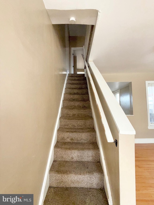 2735 N Sydenham St, Philadelphia, PA 19132 - stairway featuring baseboards and wood finished floors