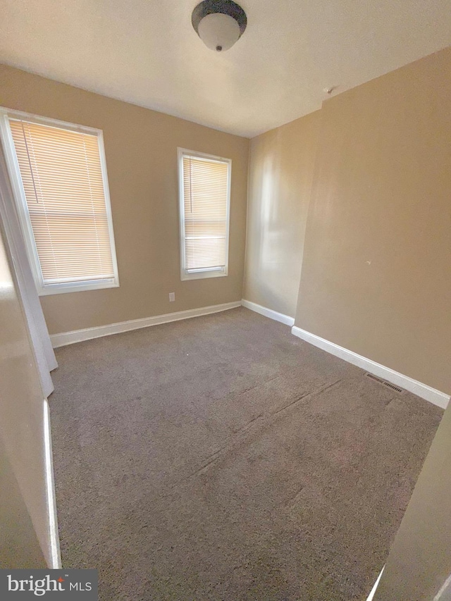 2735 N Sydenham St, Philadelphia, PA 19132 - carpeted spare room featuring baseboards