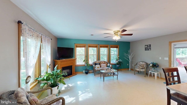 14701 Viewcrest Rd SW, Cresaptown, MD 21502 - living room with ceiling fan, a glass covered fireplace, and baseboards