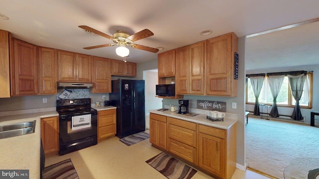 14701 Viewcrest Rd SW, Cresaptown, MD 21502 - kitchen with black appliances, light countertops, ceiling fan, a sink, and light colored carpet