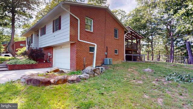 14701 Viewcrest Rd SW, Cresaptown, MD 21502 - view of property exterior with an attached garage, brick siding, cooling unit, driveway, and a wooden deck