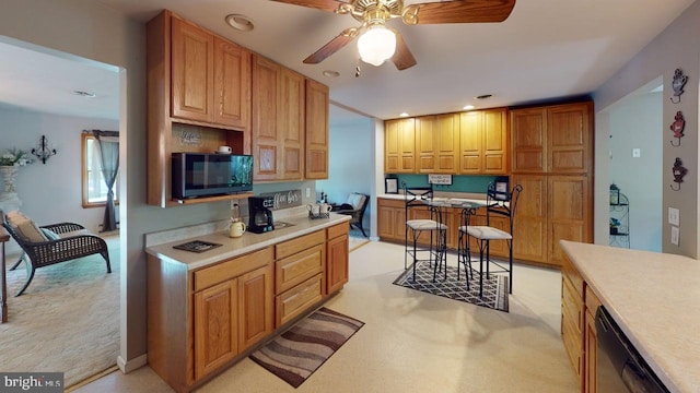 14701 Viewcrest Rd SW, Cresaptown, MD 21502 - kitchen featuring dishwashing machine, a ceiling fan, light countertops, recessed lighting, and light carpet