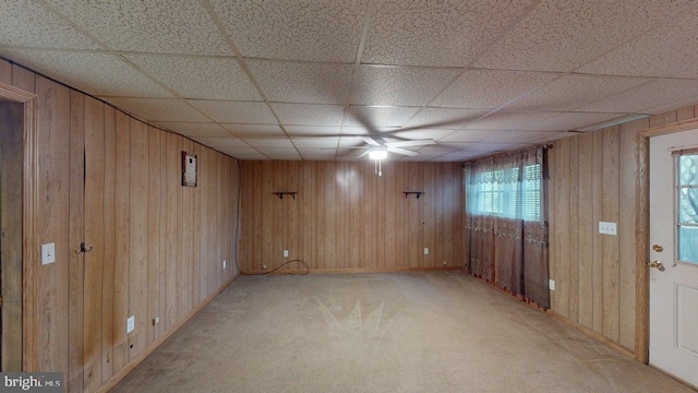 14701 Viewcrest Rd SW, Cresaptown, MD 21502 - empty room featuring ceiling fan, wood walls, light carpet, a drop ceiling, and baseboards