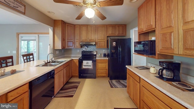 14701 Viewcrest Rd SW, Cresaptown, MD 21502 - kitchen featuring black appliances, under cabinet range hood, a sink, and light countertops