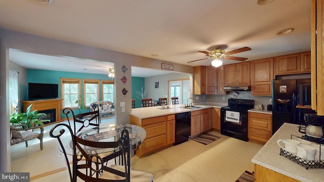 14701 Viewcrest Rd SW, Cresaptown, MD 21502 - kitchen with black appliances, ceiling fan, a sink, and under cabinet range hood