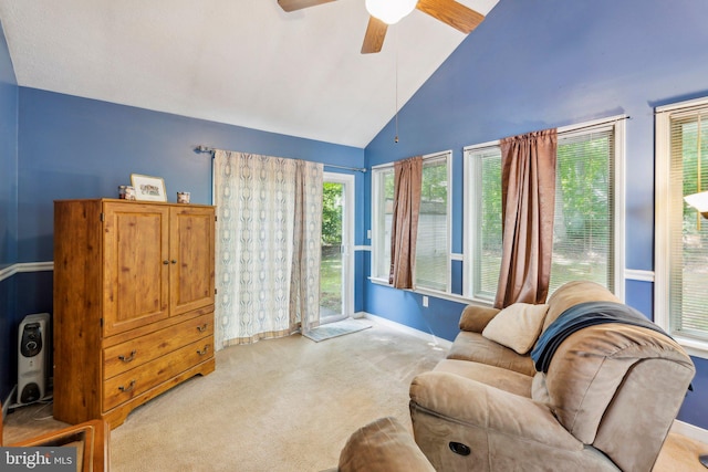 721 Canterbury Dr, Ruther Glen, VA 22546 - living area with carpet floors, ceiling fan, baseboards, and high vaulted ceiling