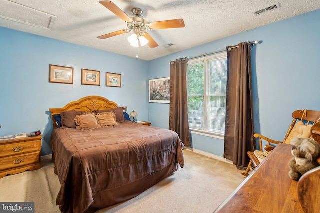 721 Canterbury Dr, Ruther Glen, VA 22546 - bedroom featuring a textured ceiling, light carpet, baseboards, and a ceiling fan