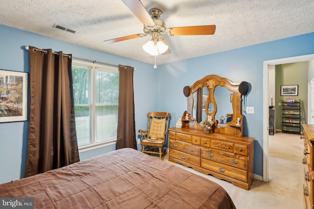 721 Canterbury Dr, Ruther Glen, VA 22546 - bedroom with carpet, a textured ceiling, and ceiling fan