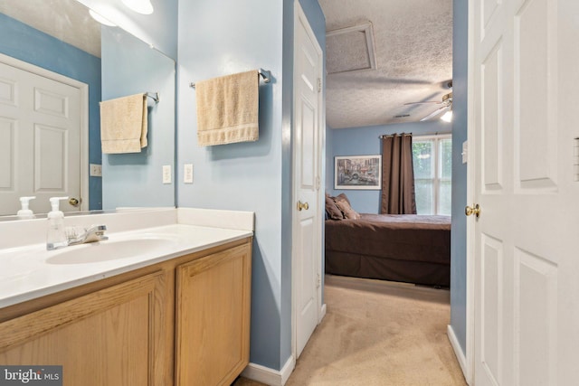721 Canterbury Dr, Ruther Glen, VA 22546 - ensuite bathroom featuring vanity, a textured ceiling, ceiling fan, and baseboards
