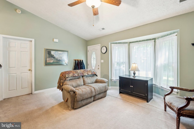 721 Canterbury Dr, Ruther Glen, VA 22546 - living area with light colored carpet, a ceiling fan, baseboards, and vaulted ceiling