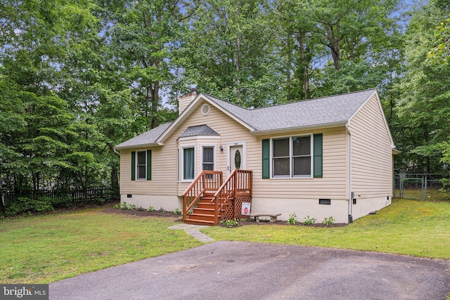 721 Canterbury Dr, Ruther Glen, VA 22546 - view of front of property with crawl space, a chimney, a shingled roof, and view of wooded area