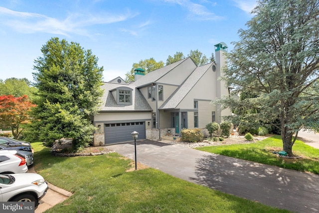 1445 Waterfront Rd, Reston, VA 20194 - view of front of property featuring driveway, a front lawn, and a chimney