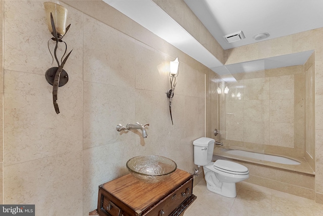 1445 Waterfront Rd, Reston, VA 20194 - full bathroom with toilet, tile patterned flooring, tub / shower combination, vanity, and tile walls