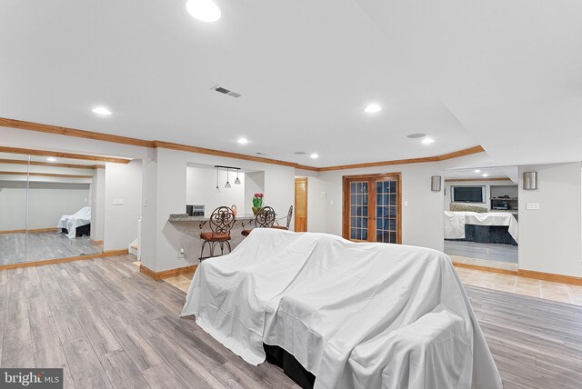 1445 Waterfront Rd, Reston, VA 20194 - living room with recessed lighting, ornamental molding, baseboards, and wood finished floors