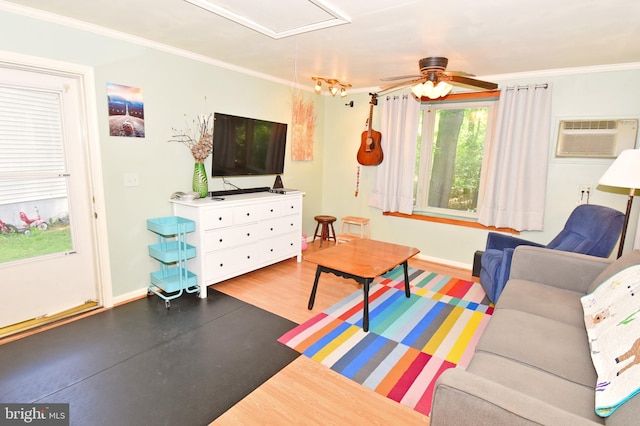 6 Quincy Ct, Ocean Pines, MD 21811 - living area with attic access, a wall unit AC, plenty of natural light, a ceiling fan, and crown molding