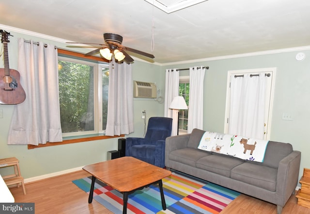 6 Quincy Ct, Ocean Pines, MD 21811 - living room featuring wood finished floors, ornamental molding, ceiling fan, a wall mounted air conditioner, and baseboards