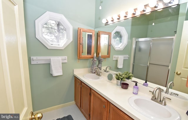 6 Quincy Ct, Ocean Pines, MD 21811 - bathroom with a shower stall, double vanity, baseboards, and tile patterned floors