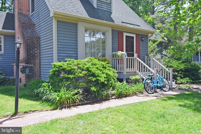 6 Quincy Ct, Ocean Pines, MD 21811 - entrance to property featuring a lawn and a shingled roof