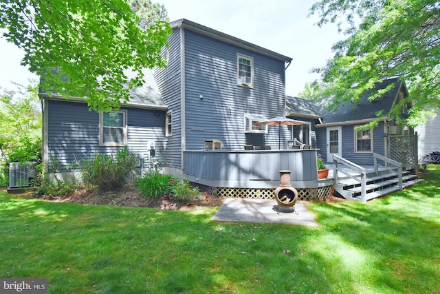 6 Quincy Ct, Ocean Pines, MD 21811 - rear view of house with a wooden deck, a lawn, and a patio