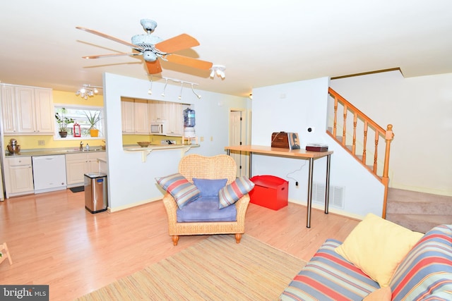 6 Quincy Ct, Ocean Pines, MD 21811 - living area with light wood-style floors, stairway, ceiling fan, and baseboards
