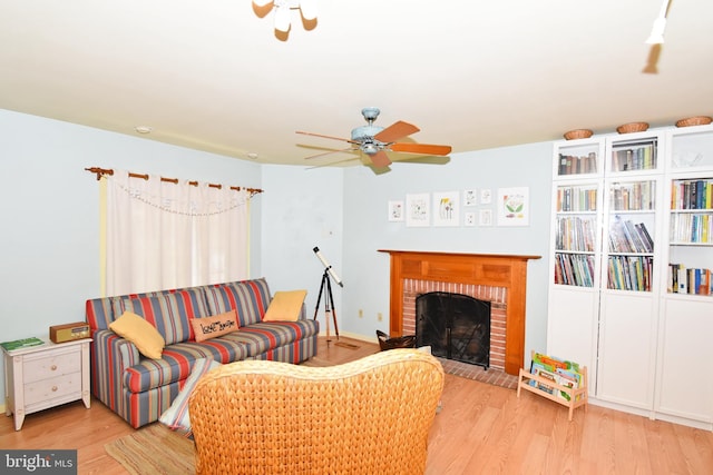 6 Quincy Ct, Ocean Pines, MD 21811 - living room featuring a ceiling fan, wood finished floors, and a brick fireplace